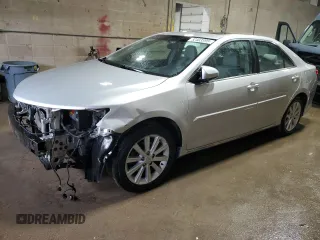 2014 Toyota Camry SE with VIN 4T1BK1FK0EU024666, listed as a Copart auction lot 52403395 with 129,728 mi miles and Salvage Title. Bid and sale history available at carsss.com. Image 1.