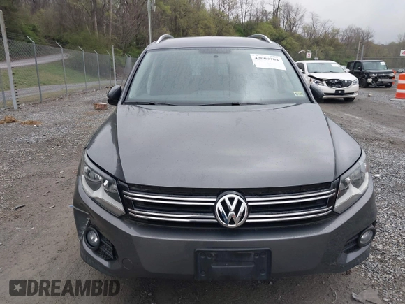 2013 Volkswagen Tiguan SE with VIN WVGAV7AX9DW547633, listed as a IAAI auction lot 42009704 with 51,826 mi miles and . Bid and sale history available at DreamBid. Image 12.