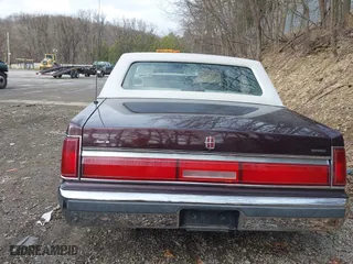 1987 Lincoln Town Car with VIN 1LNBM81F5HY704217, listed as a IAAI auction lot 41855678 with 86,794 mi miles. Bid and sale history available at carsss.com. Image 14.