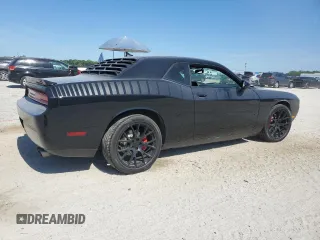 2014 Dodge Challenger R/T z VIN 2C3CDYBT6EH112199, wystawiony jako Copart lot #58023535 z przebiegiem 99 977 mil mil oraz Szkody całkowita. Historia ofert i sprzedaży dostępna na DreamBid. Obrazek 3.
