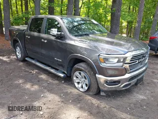2021 Ram 1500 Laramie with VIN 1C6SRFJTXMN734090, listed as a IAAI auction lot 42275076 with 72,607 mi miles and . Bid and sale history available at DreamBid. Image 1.