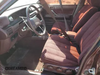1989 Toyota Camry DLX z VIN 4T1SV21E3KU053153, wystawiony jako Copart lot #49917485 z przebiegiem 79 028 mil mil oraz Szkoda całkowita • Salvage title. Historia ofert i sprzedaży dostępna na DreamBid. Obrazek 7.
