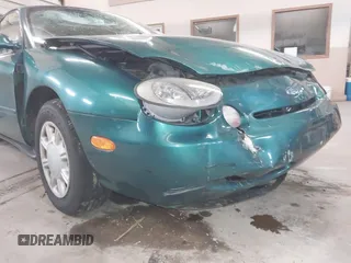 1996 Ford Taurus GL z VIN 1FALP52U5TG110582, wystawiony jako IAAI lot #40858639 z przebiegiem 57 965 mil mil oraz . Historia ofert i sprzedaży dostępna na DreamBid. Obrazek 6.