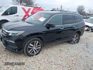 2017 Honda Pilot Touring with VIN 5FNYF6H90HB051700, listed as a IAAI auction lot 41902075 with 69,712 mi miles. Bid and sale history available at carsss.com. Image 2.