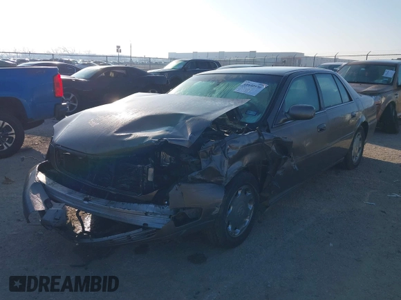 2002 Cadillac DeVille DHS z VIN 1G6KE57Y52U283531, wystawiony jako IAAI lot #41640930 z przebiegiem 94 435 mil mil oraz . Historia ofert i sprzedaży dostępna na DreamBid. Obrazek 2.