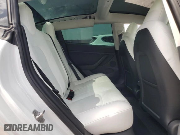 2023 Tesla Model 3 with VIN 5YJ3E1EA8PF499535, listed as a Copart auction lot 59974115 with 18,365 mi miles and Salvage title. Bid and sale history available at DreamBid. Image 10.