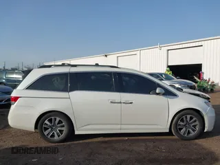 2014 Honda Odyssey Touring with VIN 5FNRL5H97EB037358, listed as a IAAI auction lot 41832825 with 208,894 mi miles and . Bid and sale history available at DreamBid. Image 13.