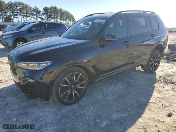 2019 BMW X7 xDrive50i with VIN 5UXCX4C51KLB39547, listed as a Copart auction lot 87908475 with 77,104 mi miles and Salvage Title. Bid and sale history available at carsss.com. Image 1.