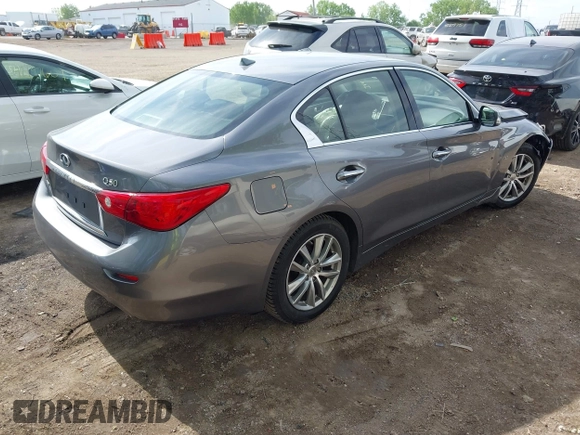 2015 Infiniti Q50 Premium z VIN JN1BV7AR1FM398047, wystawiony jako IAAI lot #42203862 z przebiegiem 104 002 mil mil oraz . Historia ofert i sprzedaży dostępna na DreamBid. Obrazek 4.