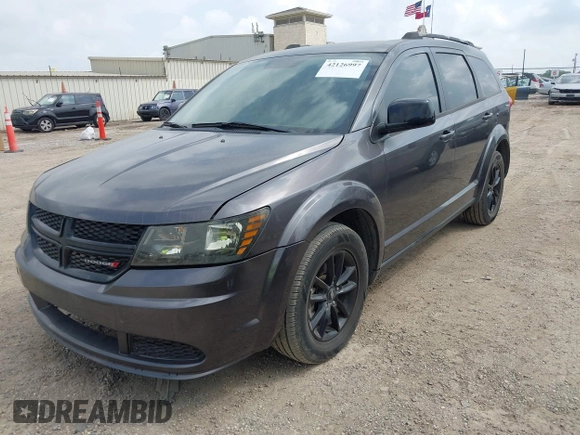 2019 Dodge Journey SE with VIN 3C4PDCBBXKT860142, listed as a IAAI auction lot 42126997 with 101,675 mi miles and . Bid and sale history available at DreamBid. Image 17.
