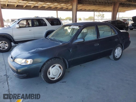 1999 Toyota Corolla VE z VIN 1NXBR12E6XZ286383, wystawiony jako Copart lot #64007215 z przebiegiem 176 069 mil mil oraz Czysty tytuł • Clean title. Historia ofert i sprzedaży dostępna na DreamBid. Obrazek 1.