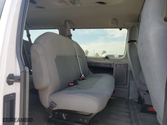 2014 Ford Econoline Wagon XL with VIN 1FBNE3BLXEDA14976, listed as a Copart auction lot 65948404 with 285,655 mi miles and Salvage Title. Bid and sale history available at carsss.com. Image 11.