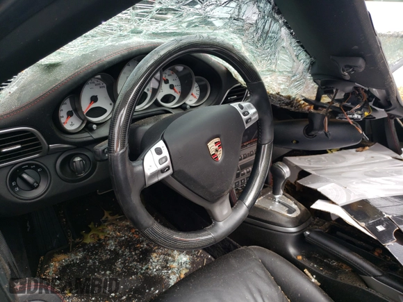 2008 Porsche 911 z VIN WP0CD29958S708310, wystawiony jako Copart lot #51357635 z przebiegiem Nie podano mil oraz Nie do naprawy • Non repairable. Historia ofert i sprzedaży dostępna na DreamBid. Obrazek 9.