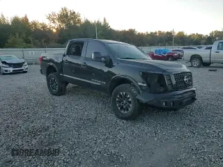 2019 Nissan Titan Pro-4X z VIN 1N6AA1E53KN525603, wystawiony jako Copart lot #77336264 z przebiegiem 64 507 mil mil oraz Szkoda całkowita • Salvage title. Historia ofert i sprzedaży dostępna na DreamBid. Obrazek 11.