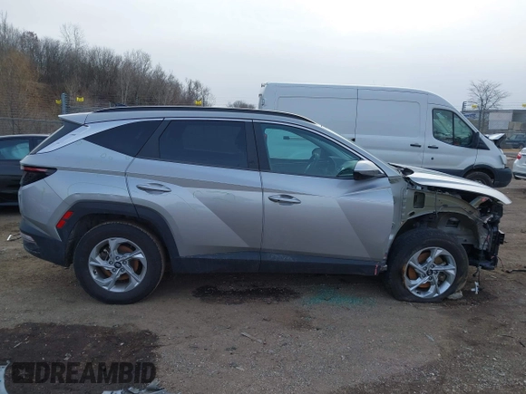 2022 Hyundai Tucson SEL z VIN 5NMJBCAE3NH070531, wystawiony jako IAAI lot #41222494 z przebiegiem 91 358 mil mil oraz . Historia ofert i sprzedaży dostępna na DreamBid. Obrazek 13.