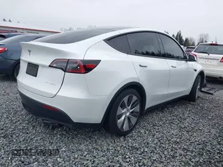 2023 Tesla Model Y Long Range with VIN 7SAYGDEE7PF809164, listed as a IAAI auction lot 41828974 with 31,772 mi miles. Bid and sale history available at carsss.com. Image 4.
