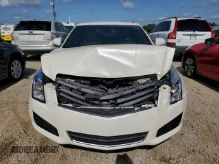 2014 Cadillac ATS Standard RWD с VIN 1G6AA5RAXE0166711, выставлен на аукционе Copart как лот 56854745 с пробегом 164 318 миль миль и Списание • Salvage title. История ставок и продаж доступна на DreamBid. Изображение 5.