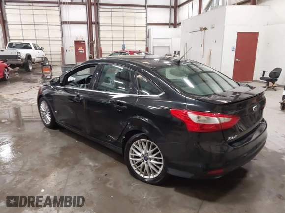 2014 Ford Focus Titanium with VIN 1FADP3J22EL199563, listed as a IAAI auction lot 41450106 with 129,271 mi miles. Bid and sale history available at carsss.com. Image 3.