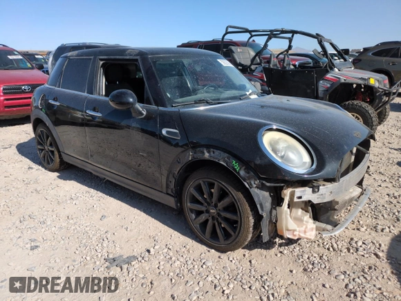 2015 MINI Hardtop 4 Door with VIN WMWXS5C51FT827202, listed as a Copart auction lot 59226065 with 130,647 mi miles and Salvage title. Bid and sale history available at DreamBid. Image 4.