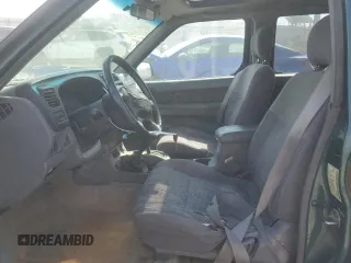 2000 Nissan Frontier XE with VIN 1N6ED27Y4YC382199, listed as a Copart auction lot 47127045 with 207,449 mi miles and Salvage title. Bid and sale history available at DreamBid. Image 7.