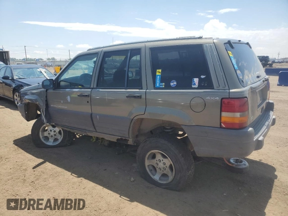 1997 Jeep Grand Cherokee Laredo z VIN 1J4GZ58S6VC636803, wystawiony jako Copart lot #59977115 z przebiegiem Nie podano mil oraz Szkoda całkowita • Salvage title. Historia ofert i sprzedaży dostępna na DreamBid. Obrazek 2.