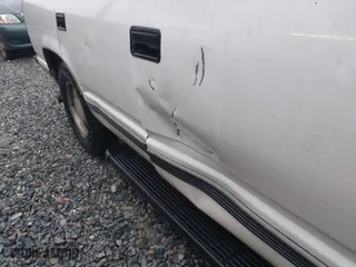 1999 Chevrolet Tahoe with VIN 1GNEC13RXXR101766, listed as a IAAI auction lot 41393447 with 387,448 mi miles. Bid and sale history available at carsss.com. Image 12.