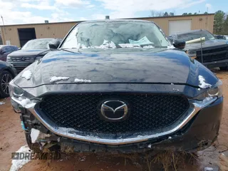 2020 Mazda CX-5 Touring z VIN JM3KFBCMXL1741182, wystawiony jako IAAI lot #41602315 z przebiegiem 31 582 mil mil oraz . Historia ofert i sprzedaży dostępna na DreamBid. Obrazek 13.