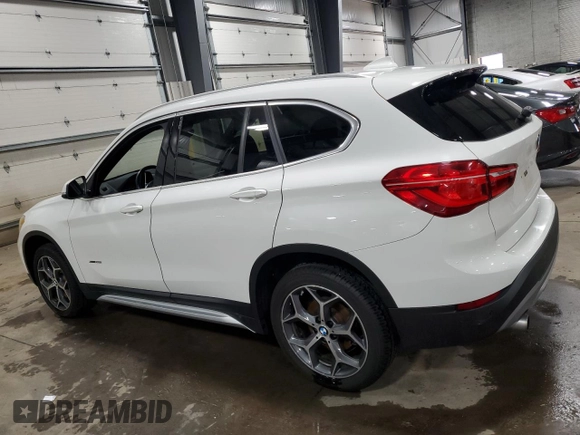 2017 BMW X1 xDrive28i with VIN WBXHT3Z38H4A53824, listed as a Copart auction lot 52500215 with 106,782 mi miles and Salvage title. Bid and sale history available at DreamBid. Image 2.