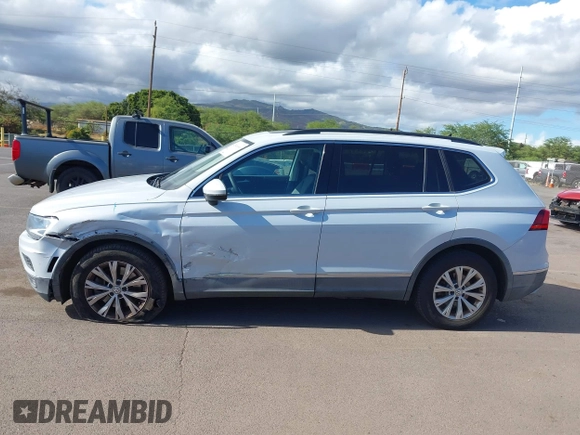 2018 Volkswagen Tiguan SEL z VIN 3VV3B7AX7JM126402, wystawiony jako IAAI lot #42046690 z przebiegiem 54 790 mil mil oraz . Historia ofert i sprzedaży dostępna na DreamBid. Obrazek 14.