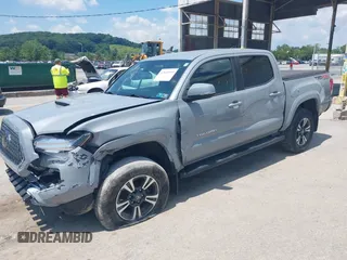 2019 Toyota Tacoma SR with VIN 3TMCZ5AN1KM274625, listed as a IAAI auction lot 42660593 with 163,460 mi miles and . Bid and sale history available at DreamBid. Image 2.