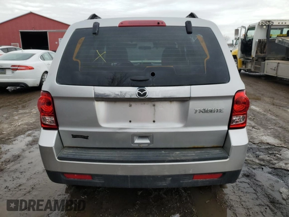 2011 Mazda Tribute Sport with VIN 4F2CY9C70BKM03826, listed as a Copart auction lot 45222665 with 171,082 mi miles and Salvage Title. Bid and sale history available at DreamBid. Image 6.