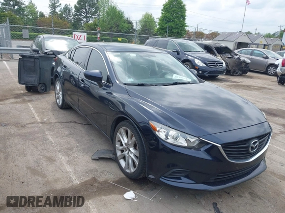 2016 Mazda Mazda6 i Touring with VIN JM1GJ1V59G1402867, listed as a IAAI auction lot 41998212 with 135,724 mi miles. Bid and sale history available at carsss.com. Image 1.