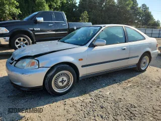 1999 Honda Civic EX with VIN 1HGEJ8241XL092859, listed as a Copart auction lot 63339935 with 114,352 mi miles and Salvage title. Bid and sale history available at DreamBid. Image 1.
