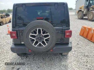 2024 Jeep Wrangler Sahara with VIN 1C4PJXEG0RW335831, listed as a Copart auction lot 61973055 with 15,785 mi miles and Salvage title. Bid and sale history available at DreamBid. Image 6.