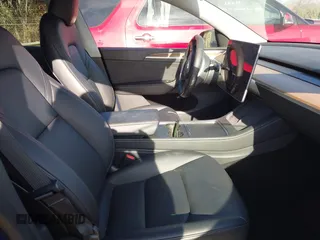 2023 Tesla Model Y Long Range with VIN 7SAYGDEE4PA042757, listed as a IAAI auction lot 41652541 with 48,569 mi miles. Bid and sale history available at carsss.com. Image 5.
