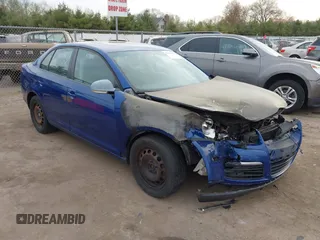 2009 Volkswagen Jetta S z VIN 3VWHM71K19M130148, wystawiony jako IAAI lot #42111032 z przebiegiem Nie podano mil oraz . Historia ofert i sprzedaży dostępna na DreamBid. Obrazek 1.