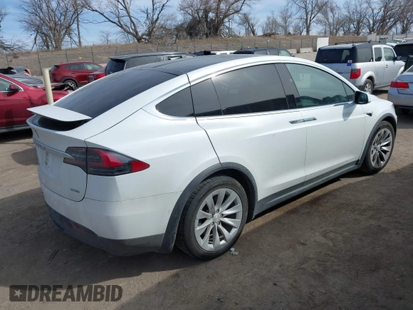 2018 Tesla Model X 75D with VIN 5YJXCBE27JF121834, listed as a IAAI auction lot 41769246 with 90,814 mi miles and . Bid and sale history available at carsss.com. Image 4.