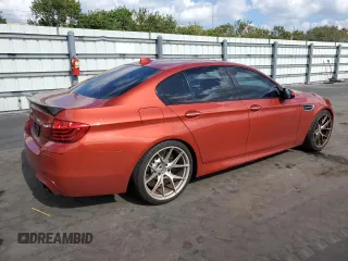 2014 BMW M5 z VIN WBSFV9C58ED097898, wystawiony jako Copart lot #86151234 z przebiegiem 60 470 mil mil oraz Tytuł czysty. Historia ofert i sprzedaży dostępna na DreamBid. Obrazek 3.