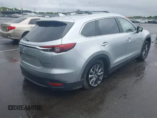 2020 Mazda CX-9 Touring with VIN JM3TCBCY8L0400787, listed as a IAAI auction lot 42188981 with 86,459 mi miles and . Bid and sale history available at DreamBid. Image 4.