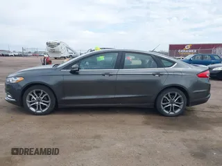 2017 Ford Fusion SE z VIN 3FA6P0H76HR354078, wystawiony jako IAAI lot #42103550 z przebiegiem 103 201 mil mil oraz . Historia ofert i sprzedaży dostępna na DreamBid. Obrazek 14.