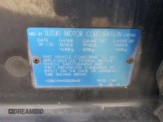 2003 Suzuki Aerio SX z VIN JS2RC41H135205642, wystawiony jako Copart lot #77690224 z przebiegiem 161 414 mil mil oraz Szkoda całkowita • Salvage title. Historia ofert i sprzedaży dostępna na DreamBid. Obrazek 15.