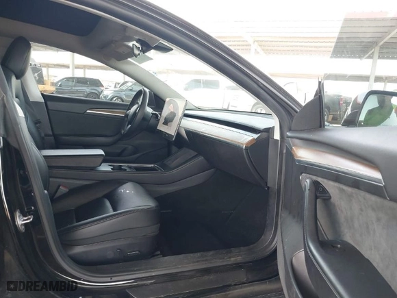 2022 Tesla Model 3 Long Range with VIN 5YJ3E1EBXNF185973, listed as a IAAI auction lot 41692577 with 131,513 mi miles. Bid and sale history available at carsss.com. Image 5.