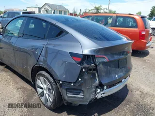 2023 Tesla Model Y Long Range with VIN 7SAYGAEE7PF615751, listed as a IAAI auction lot 42297819 with 31,201 mi miles and . Bid and sale history available at DreamBid. Image 20.