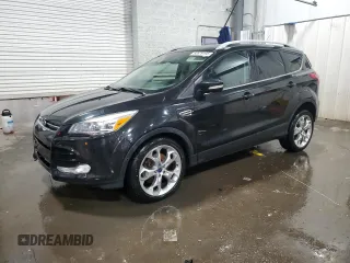 2015 Ford Escape Titanium with VIN 1FMCU9J97FUC12748, listed as a Copart auction lot 60679195 with 186,780 mi miles and Salvage title. Bid and sale history available at DreamBid. Image 1.