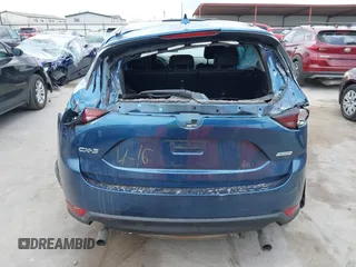 2018 Mazda CX-5 Touring z VIN JM3KFACM5J1442416, wystawiony jako IAAI lot #42093137 z przebiegiem 65 102 mil mil oraz . Historia ofert i sprzedaży dostępna na DreamBid. Obrazek 17.