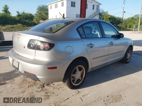 2007 Mazda Mazda3 i Sport with VIN JM1BK12F371721654, listed as a IAAI auction lot 42019268 with 120,518 mi miles. Bid and sale history available at carsss.com. Image 4.