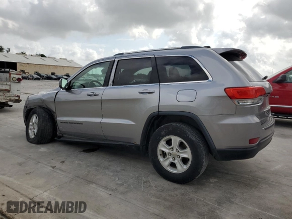 2017 Jeep Grand Cherokee Laredo with VIN 1C4RJEAG0HC664063, listed as a Copart auction lot 54850295 with 82,913 mi miles and Salvage title. Bid and sale history available at DreamBid. Image 2.