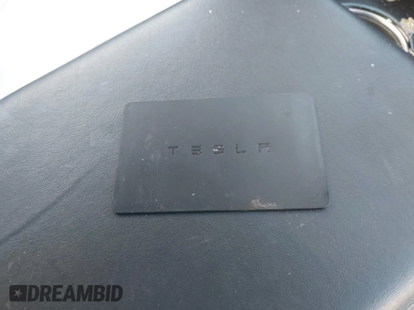 2018 Tesla Model 3 Long Range Battery with VIN 5YJ3E1EBXJF055203, listed as a IAAI auction lot 42019770 with 57,379 mi miles and . Bid and sale history available at DreamBid. Image 11.