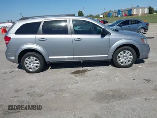 2018 Dodge Journey SE z VIN 3C4PDCAB8JT344720, wystawiony jako IAAI lot #40491703 z przebiegiem 86 601 mil mil oraz . Historia ofert i sprzedaży dostępna na DreamBid. Obrazek 13.