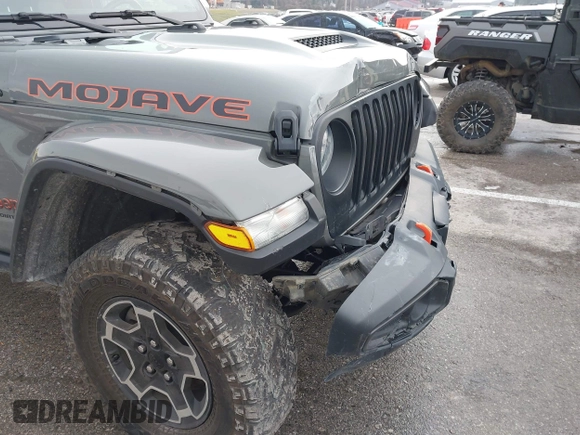 2022 Jeep Gladiator Mojave z VIN 1C6JJTEG8NL130971, wystawiony jako IAAI lot #41163074 z przebiegiem 47 142 mil mil oraz . Historia ofert i sprzedaży dostępna na DreamBid. Obrazek 19.
